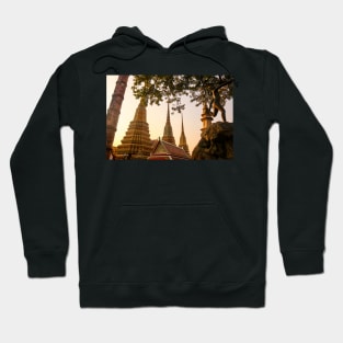 Mosaic tiled Buddha stupas and an iron sculpture at Wat Pho temple. Hoodie